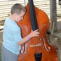 Kids get to try out instruments at the 2018 Marshall Bluegrass Festival - photo © Bill Warren