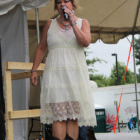 MC Cindy Baucom at Red, White & Bluegrass 2018 - photo by Laura Tate Photography