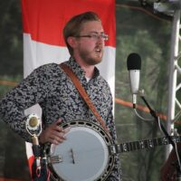 Alex Leach sits in with Po' Ramblin' Boys at the 2018 Remington Ryde Bluegrass Festival - photo by Frank Baker