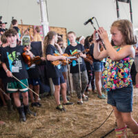 Taking a photo during Kids Academy at the 2018 Grey Fox Bluegrass Festival - photo © Tara Linhardt