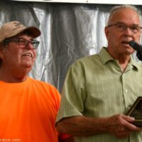Bill Warren presents Hall of Honor plaque to Jimmy Thompson at the 2018 Blissfield Bluegrass on the River - photo © Bill Warren