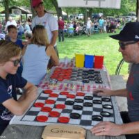 Big kids playing checkers at the 2018 Blissfield Bluegrass on the River - photo © Bill Warren