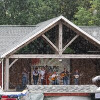 Danny Paisley & The Southern Grass in the rain at the August 2018 Gettysburg Bluegrass Festival - photo by Frank Baker