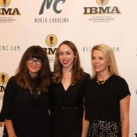 Sara Watkins, Sarah Jarosz, and Aoife O'Donovan on the red carpet at the 2018 IBMA Awards - photo © Frank Baker