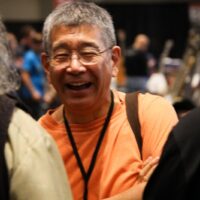 Akira Otsuka in the exhibit hall at the 2018 Wold of Bluegrass (9/26/18) - photo by Frank Baker