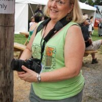 Priscilla Warnock, photog and Board member at the 2018 Delaware Valley Bluegrass Festival - photo by Frank Baker