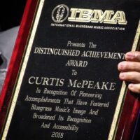 Distinguished Achievement Award for Curtis McPeake at the 2018 IBMA Special Awards - photo © Frank Baker