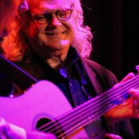 Ricky Skaggs watches Jake Workman solo at the 2018 International Bluegrass Music Awards - photo © Frank Baker