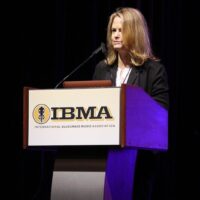 Alison Brown introduces the Distinguished Achievement Award for Christopher Howard-Williams at the 2018 IBMA Special Awards - photo © Frank Baker