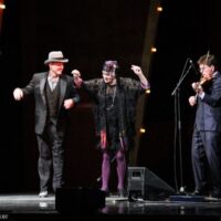 Mark and Eileen Schatz dance a few steps before presenting the Fiddle Player of the Year at the 2018 International Bluegrass Music Awards - photo © Frank Baker