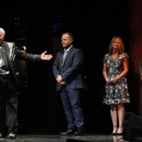 Greg Cahill and Special Consensus with producer Alison Brown accepting Album of the Year at the 2018 International Bluegrass Music Awards - photo © Frank Baker