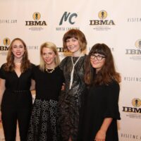 Sarah Jarosz, Aoife O'Donovan, Molly Tuttle, and Sara Watkins on the red carpet at the 2018 IBMA Awards - photo © Frank Baker