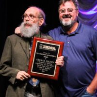 George Gruhn with Vince Gill and his Distinguished Achievement Award at the 2018 IBMA Special Awards - photo © Frank Baker
