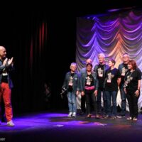 The Mayor of La Roche in France introduces the town leaders at the 2018 IBMA Special Awards - photo © Frank Baker