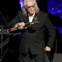 Ricky Skaggs marvels at Bill Monroe's mandolin at his induction into the Country Music Hall of Fame (10/21/18) - photo by Terry Wyatt/Getty Images