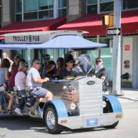 Pedal along on the Trolley Pub during StreetFest at Wide Open Bluegrass 2018 - photo © Frank Baker