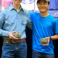 Ridge Roberts and Nathan Pendault with their buckles at the 2018 Oklahoma State Picking and Fiddling Championship - photo by Pamm Tucker