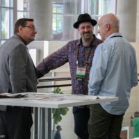 Corridor discussion with Joe Mullins, Stephen Mougin, and Ben Surratt at World of Bluegrass 2018 - photo © Frank Baker