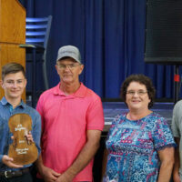 Michael Merritt with JC Broughton Rising Star award at the 2018 Oklahoma State Picking and Fiddling Championship - photo by Pamm Tucker