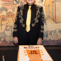 Del McCoury with his 15th Anniversary cake at the Grand Ole Opry presents Del McCoury with a 15th Anniversary print (11/3/18) - photo by Chris Hollo