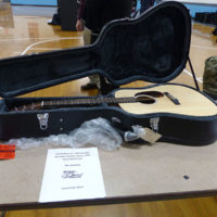 Martin guitar sold at auction at Alan Perdue's benefit concert - photo by Sandy Hatley