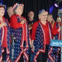 Jan Ladd and Friends sing the anthem at the 2019 Yee Haw Music Fest - photo © Bill Warren