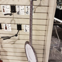 Cardboard banjo on pegboard hanger at the 2019 NAMM Show in Anaheim, CA - photo by Danny Clark