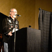 Kevin Slick speaks during the CBMS Hall of Honor at the 2019 MidWinter Bluegrass Festival