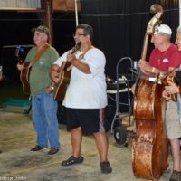 Ernie Evans leads the square dance band at the 2019 Florida Bluegrass Classic - photo © Bill Warren