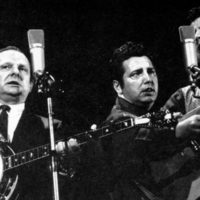 Ralph Stanley playing the eagle banjo in Japan with Jack Cooke and Roy Lee Centers