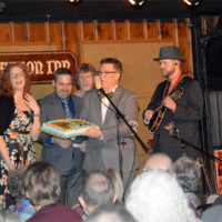 Becky Buller Band presents the boss with her 40th birthday cake at The Station Inn (1/31/19) - photo by Bill Conger