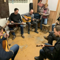 Jam session breaks out at the grand opening of the new shop shared by BanjoLit and Coall Instruments