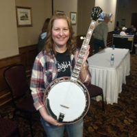Angel Lewis with her new banjo at Ohio Bluegrass Winter Weekend - photo by Chris Smith