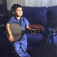 A young Kelley Gibson with his banjo