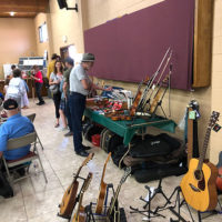 Instruments for sale at the California State Old Time Open Fiddle & Picking Championships at Lodi, CA - photo by Dave Berry