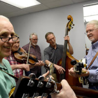 Marc Pruett Band warms up backstage at the Steve Sutton benefit concert  - photo by Wayne Ebinger