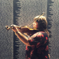 Amy Lavicky plays her fiddle at the Site Nam vets Wall That Heals