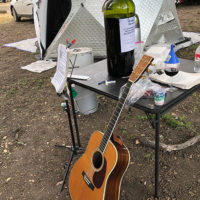 Big bottle and guitar at the 2019 Parkfield Bluegrass Festival - photo by Dave Berry