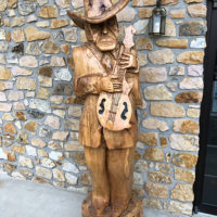 Wooden carving in front of the museum at the 2019 John Hartford Memorial Festival at Bean Blossom - photo by Dave Berry