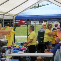 Selling those shirts at the 2019 Willow Oak Park Bluegrass Festival - photo by Laura Ridge