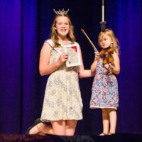 Jayne Huguenin getting youngest fiddler award at Weiser 2019 - photo © Tara Linhardt