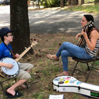 Banjo lesson at the CBA Youth Academy Camp - photo by Dave Berry