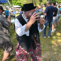 Clown with a camera at the 2019 John Hartford Memorial Festival at Bean Blossom - photo by Dave Berry