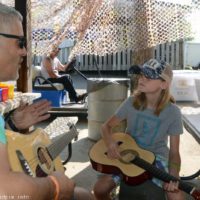 Youngsters get to try out instruments at the 2019 Marshall Bluegrass Festival - photo © Bill Warren