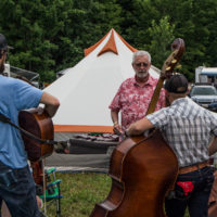 Steve Martin of Unreal Bluegrass talks to bands at Grey Fox 2019 - photo © Tara Linhardt