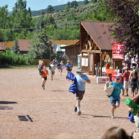 Infamous tarp run at the 2019 RockyGrass Festival, where attendees race to the site to set up their listening spot - photo by Kevin Slick