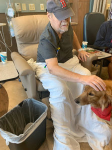 Phil Leadbetter at the hospital with his new friend, Dolly, the therapy dog