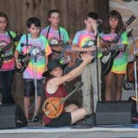Tara Linhardt cheers on the Kid's Academy on the main stage at the August 2019 Gettysburg Bluegrass Festival - photo by Frank Baker