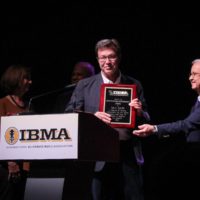 Dan Hays accepts his Distinguished Achievement Award at the 2019 IBMA Industry Awards - photo by Frank Baker