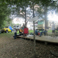 Campers take advantage of the Pickin' Porch at the 2019 Armuchee Bluegrass Festival - photo by Audie Finnell